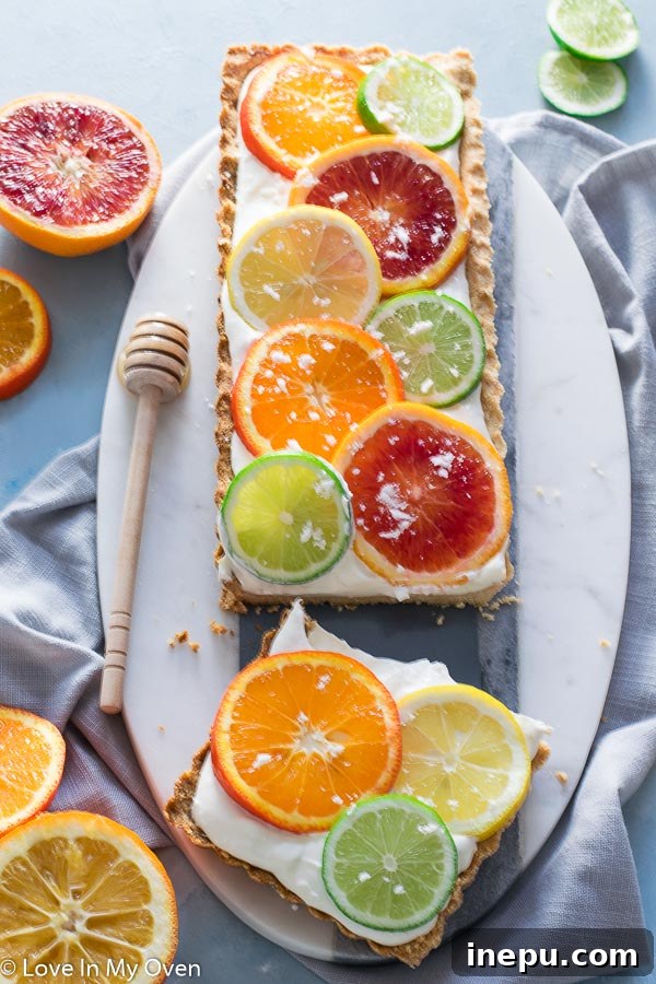 Beautifully decorated sunny citrus tart with fresh lemon slices