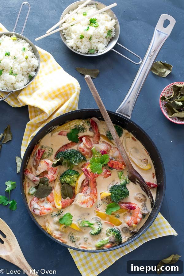 Overhead shot of the Red Thai Prawn Curry and Cilantro-Lime Cauliflower Rice, highlighting the vibrant ingredients.