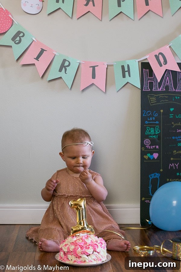 Hattie celebrating her first birthday with a delightful healthy smash cake.