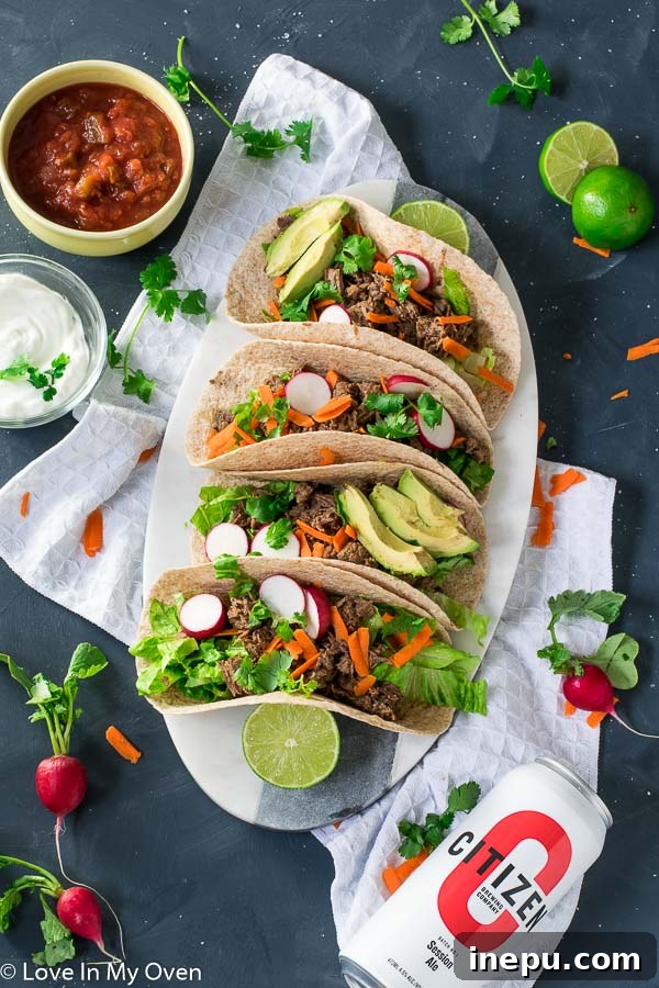 Delicious Instant Pot Beef Barbacoa Tacos - perfect for an easy weeknight meal.