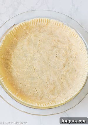 Guilt-Free Blueberry Delight 5 pressing almond flour dough into pie plate