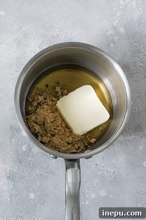 Close-up of toasted oats and shredded coconut, ready for mixing into granola bars for enhanced flavor.