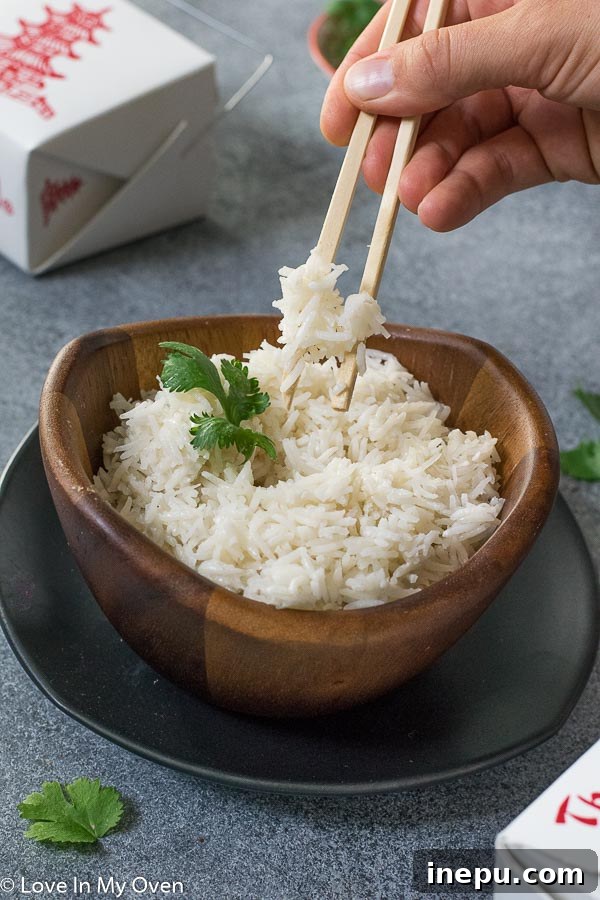 Easy Coconut Rice, styled in a bowl with a fork
