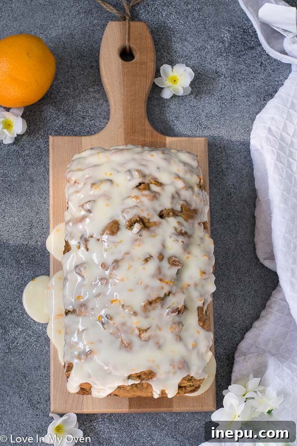 Moist and Flavorful Orange Zucchini Bread with a delicate glaze