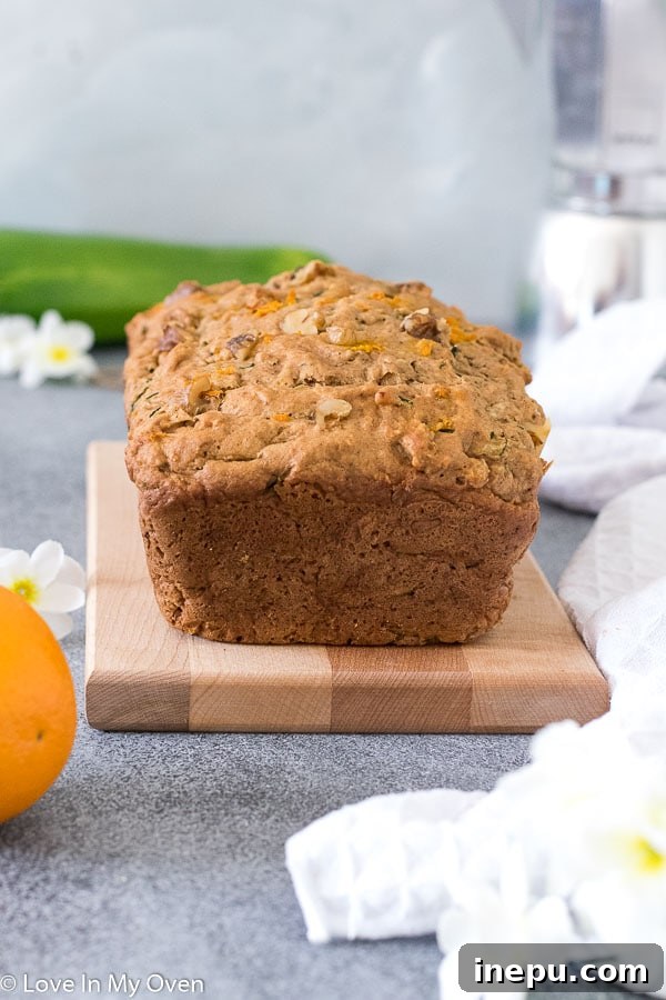 Close-up of freshly baked Orange Zucchini Bread with walnuts