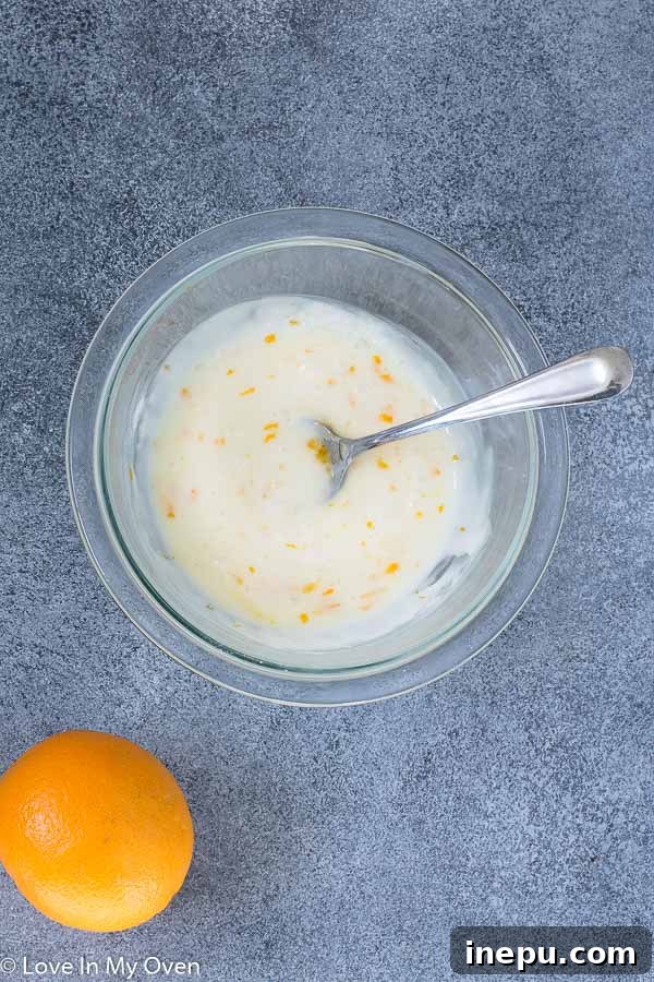 Orange Zucchini Bread drizzled with orange glaze