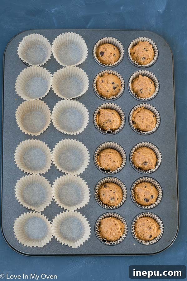 Spiced Pumpkin Bites 5 Mini pumpkin muffins baking to golden perfection in the oven