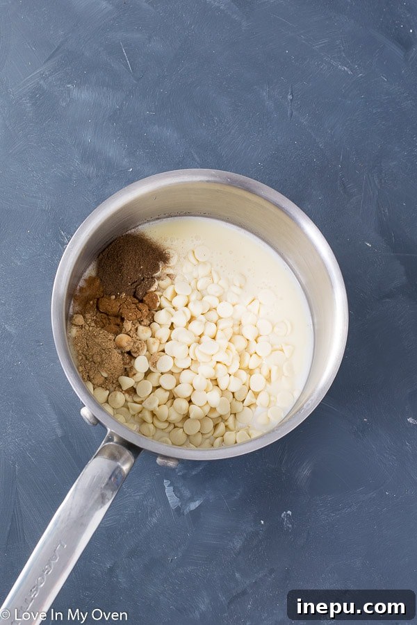 Ingredients for 3-ingredient gingerbread fudge: condensed milk, white chocolate chips, and gingerbread spices
