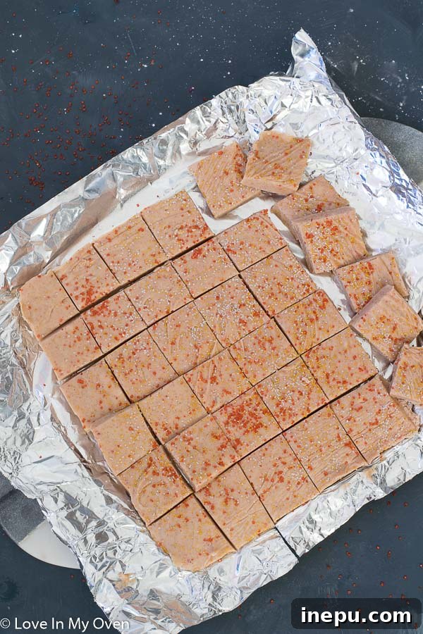 Perfectly cut squares of gingerbread fudge on a festive plate, ready to be served