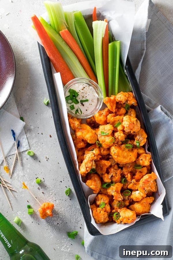 Crispy Air Fryer Buffalo Cauliflower Wings 2 Crispy Air Fryer Buffalo Cauliflower Bites on a platter, ready to serve.