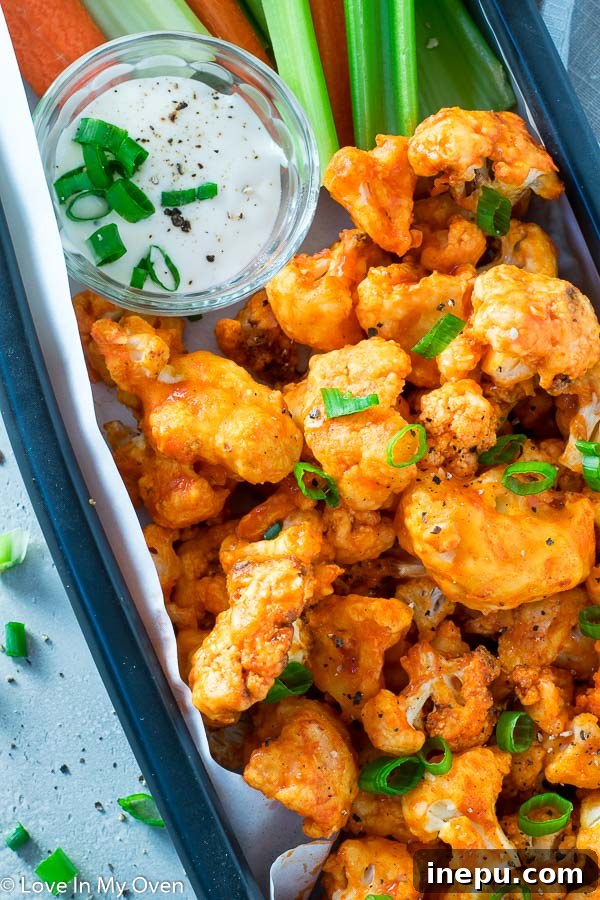 Crispy Air Fryer Buffalo Cauliflower Wings 3 Air Fryer Buffalo Cauliflower in a bowl, showing crispy texture and vibrant sauce.