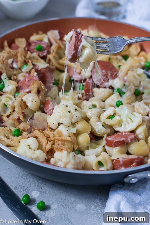 overhead shot of veggie and sausage pasta skillet, ready to serve