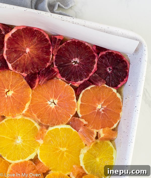 Caramelized Orange Bliss 5 Close-up of orange slices with small pieces filling the gaps in the pan