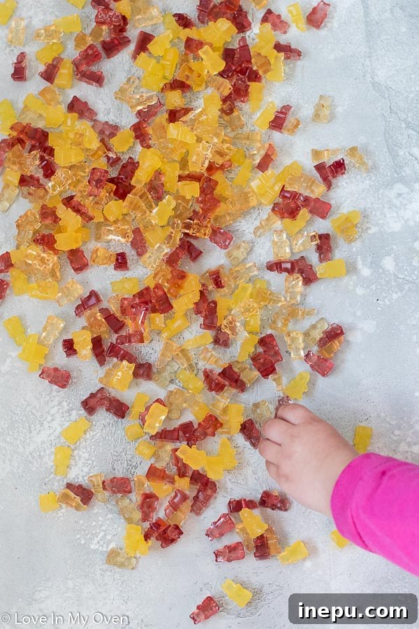 DIY Gummy Bear Magic 6 A child's hand reaching for homemade gummy bears, showcasing their appeal