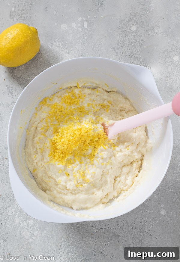 Zesty Lemon Glazed Muffins 5 Mixing muffin batter