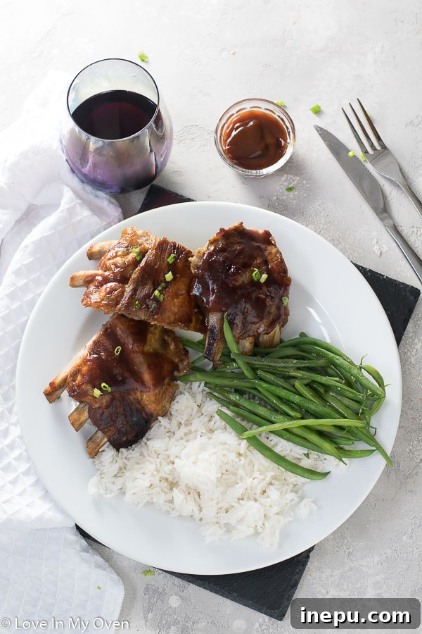 Melt-in-Your-Mouth Slow Cooker Ribs 8 Close up of tender, saucy slow cooker ribs