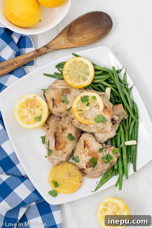 Lemon Garlic Chicken Thighs in Instant Pot – A close-up of the cooked chicken with sauce, ready to serve.
