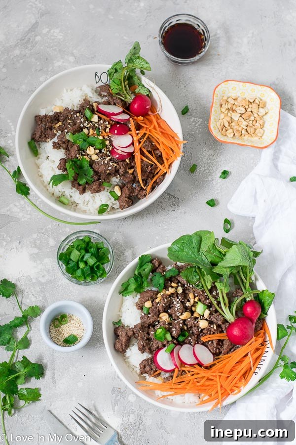 Sticky Hoisin Beef Bowls 2 Delicious Hoisin Beef Bowls with fresh vegetables and crushed nuts