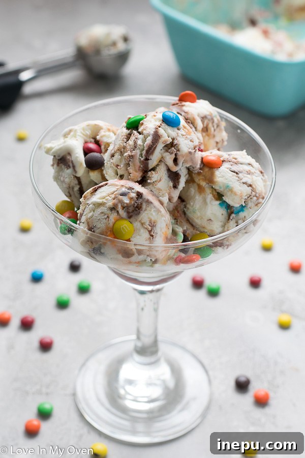 Thursday's Top 10 Insights 2 Delicious no-churn vanilla ice cream with chocolate ganache, dulce de leche, and M&M's, perfect for a summer treat.