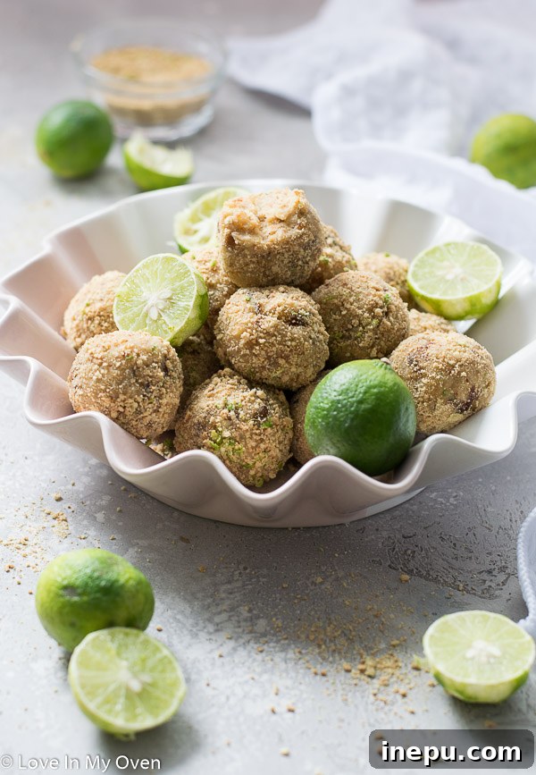 Zesty Key Lime Cheesecake Treats 8 Close-up of a healthy key lime cheesecake bite, showing inner texture and outer coating