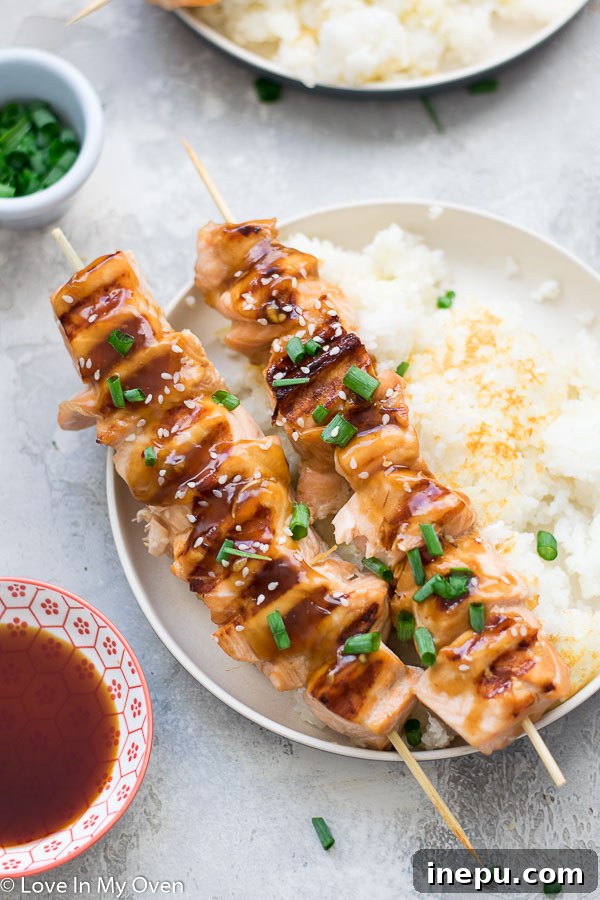 Close-up of perfectly flaky teriyaki salmon skewers