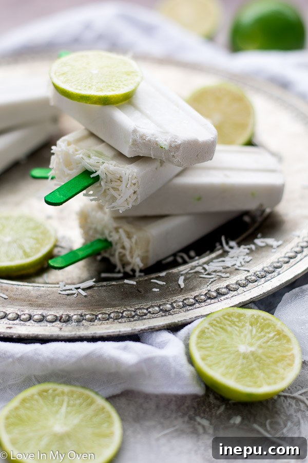 Zesty Coconut Lime Bliss 2 Refreshing homemade coconut lime popsicles, perfect for a summer treat.