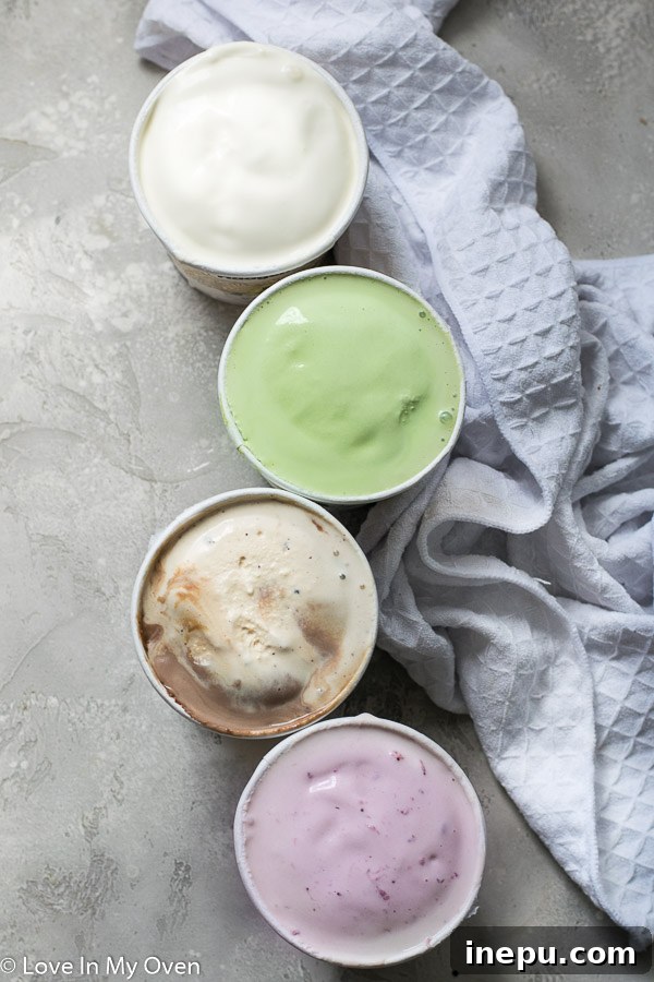 Four different ice cream flavors (vanilla, matcha, salted caramel, strawberry) prepared for filling popsicle molds