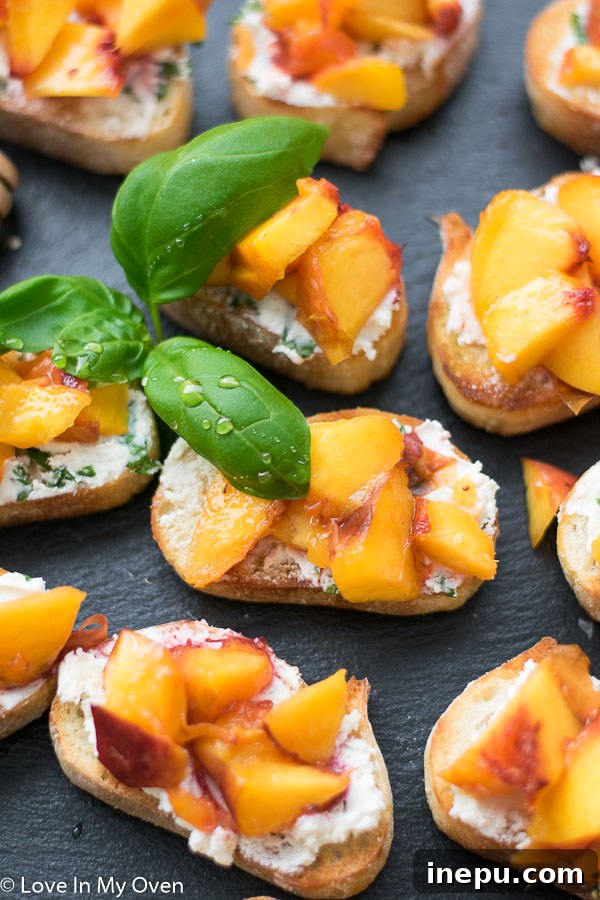 Close-up of a single grilled peach crostini ready to be eaten