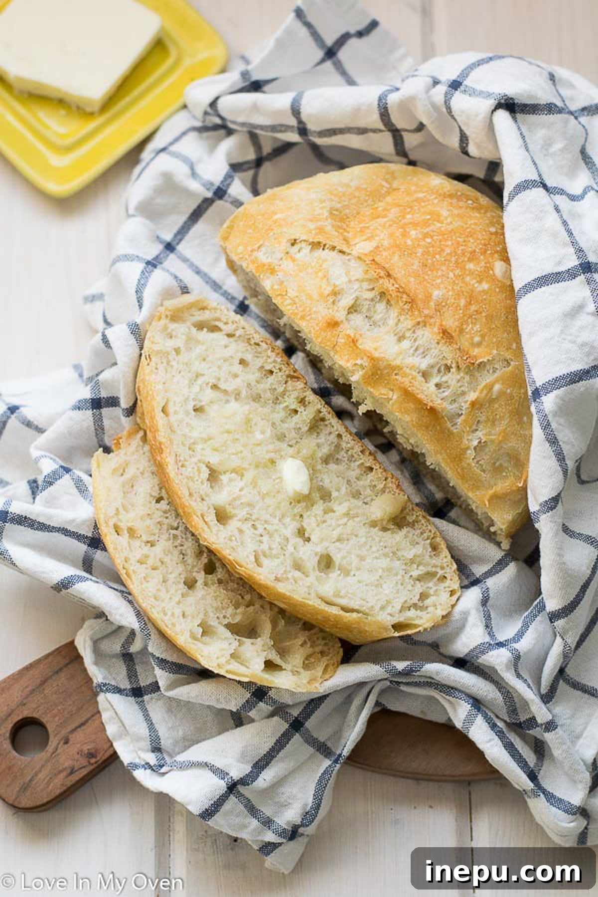 Effortless 3-Ingredient Bread 8 Hearty slice of no knead bread with butter