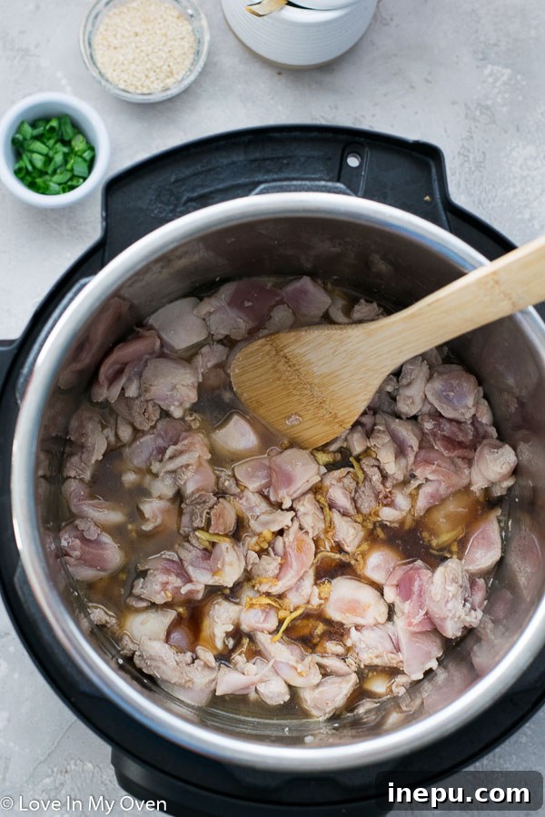 Instant Pot Sesame Chicken served over rice
