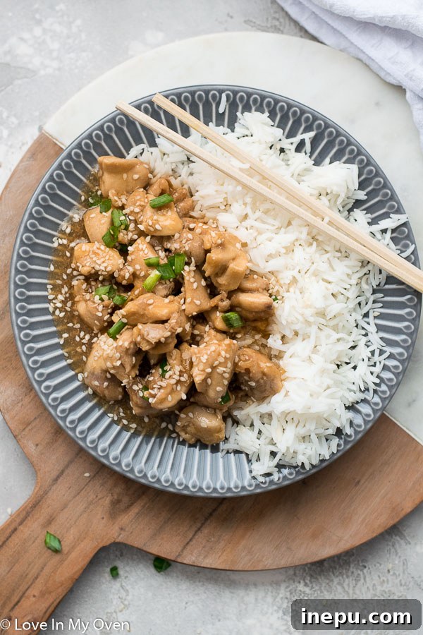 Instant Pot Sesame Chicken plated with garnishes