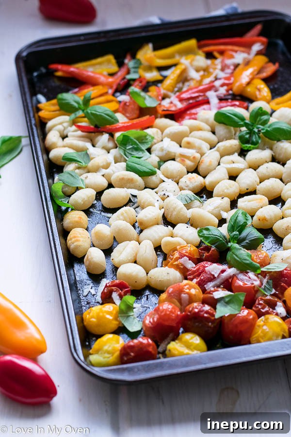 Golden Crunch Gnocchi Bake 3 Crispy Gnocchi with colorful vegetables on a baking sheet