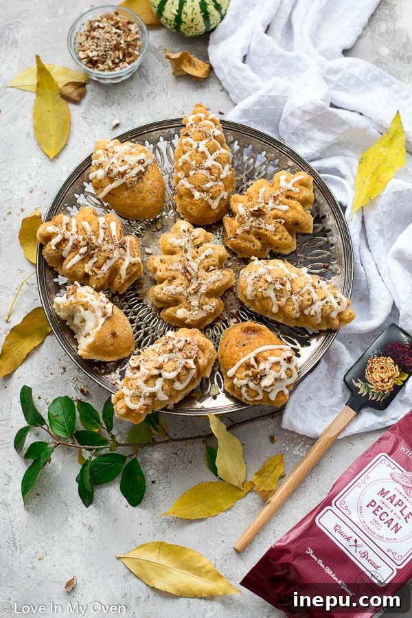 Petite Maple Pecan Treasures 2 Delicious mini maple pecan cakes arranged on a wooden board