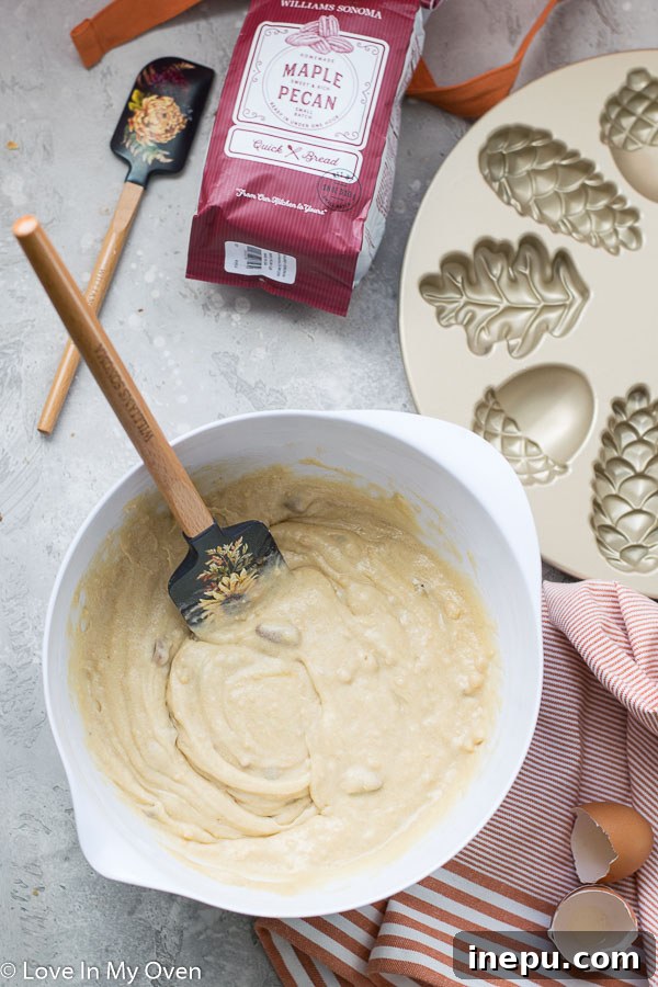 Petite Maple Pecan Treasures 4 Mixing the ingredients for maple pecan cake batter in a bowl