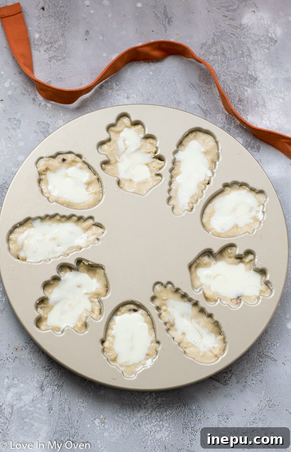 Petite Maple Pecan Treasures 5 Maple pecan cake batter and cream cheese filling layered in a mini bundt pan