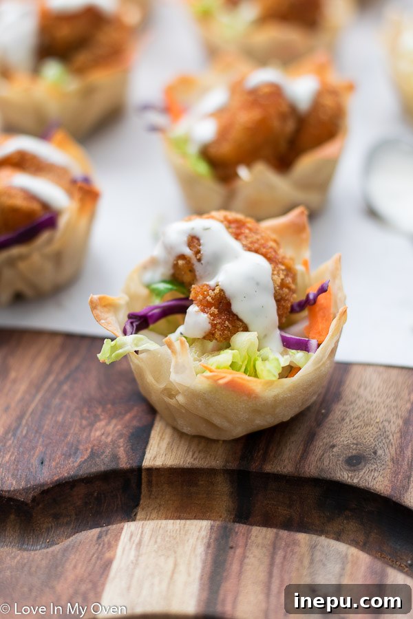 Close-up of baked wonton cups, golden brown and perfectly shaped, ready for filling.