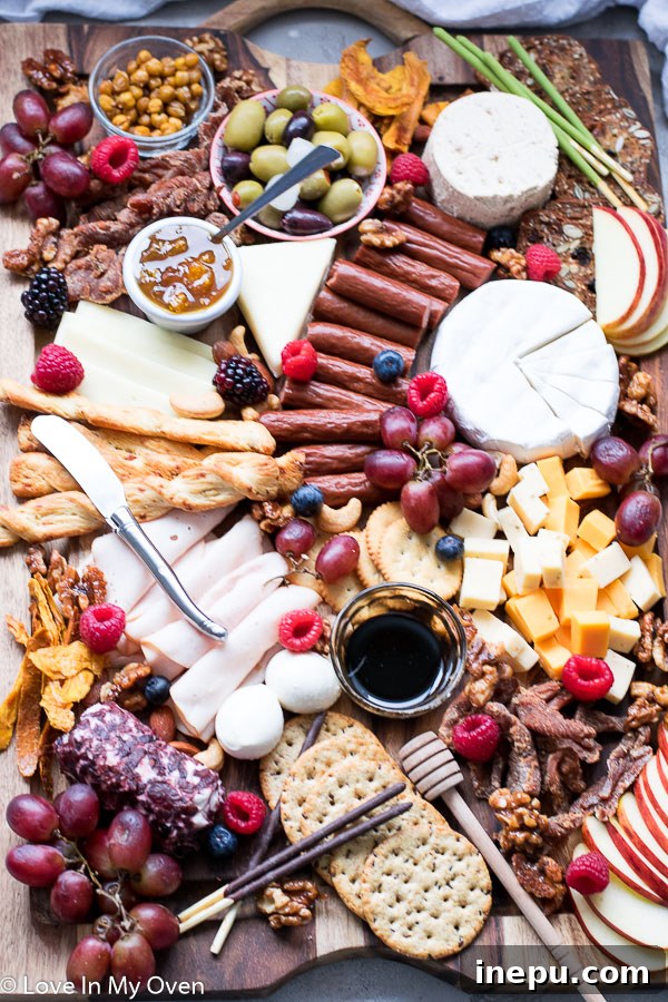 Gobble & Graze Board 2 Festive turkey charcuterie board with various meats, cheeses, fruits, and crackers arranged for holiday entertaining