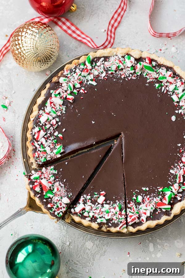 Decadent Grain Free Peppermint Chocolate Tart 7 Decorated peppermint chocolate tart with candy canes