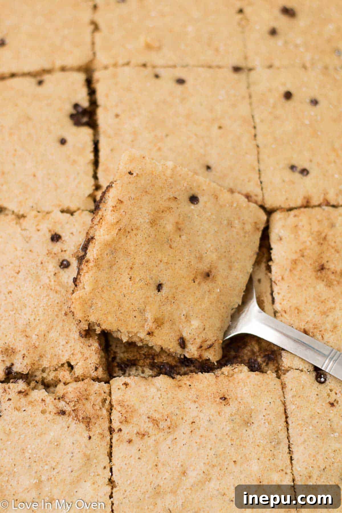 Perfectly golden chocolate chip baked pancakes cut into squares