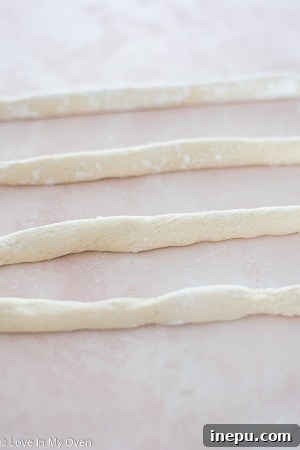Rolling cauliflower gnocchi dough into ropes