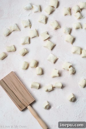 Cutting cauliflower gnocchi into pieces