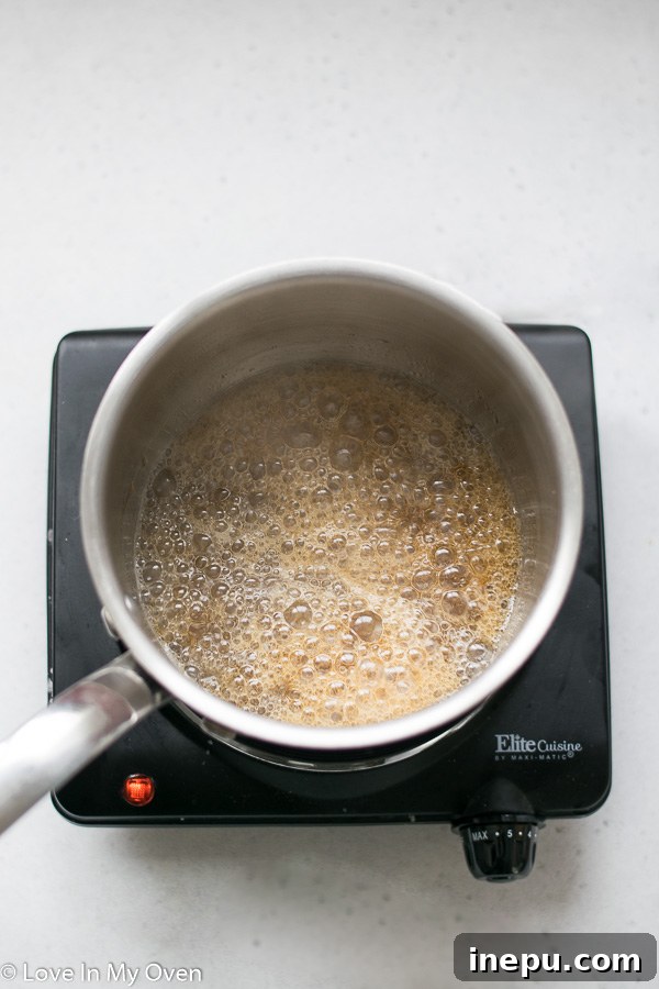 Guilt-Free Caramel Popcorn 5 Maple syrup and coconut oil simmering for healthy caramel