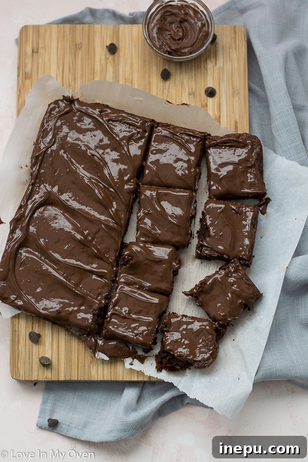 Effortless 3-Ingredient Nutella Brownies 2 Deliciously fudgy 3-ingredient Nutella brownies on a cooling rack, ready to be frosted.