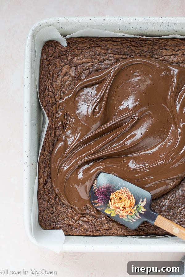 Effortless 3-Ingredient Nutella Brownies 6 Nutella brownie batter being smoothed into the baking pan.