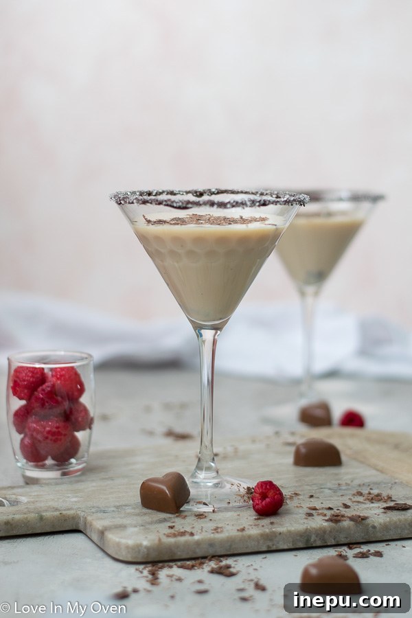 Midnight Chocolate Martini 2 Lush chocolate vodka martini with shaved chocolate garnish, perfect for a cozy night in.