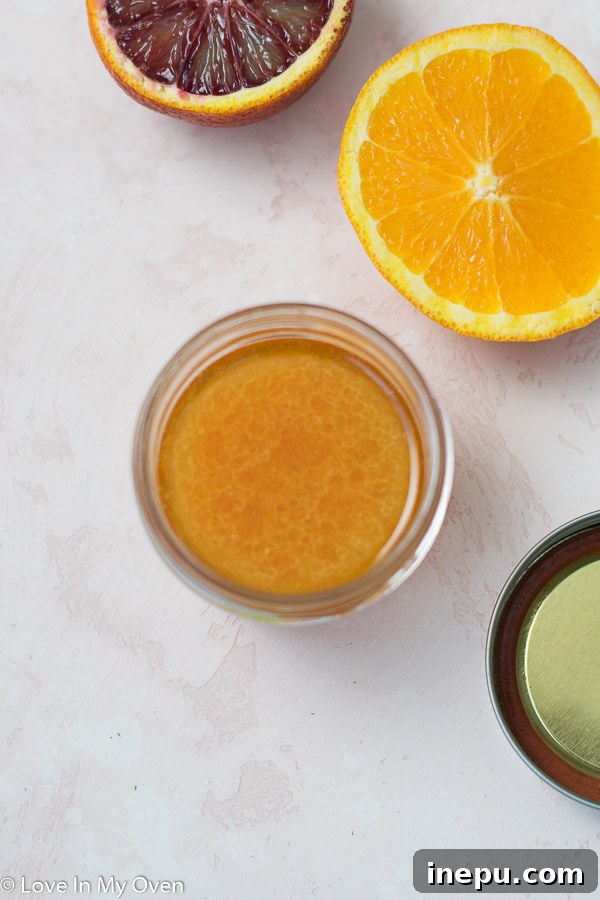Zesty Orange Beet Salad 5 Homemade citrus salad dressing in a jar with fresh oranges
