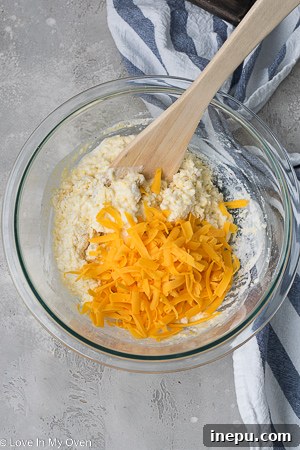 Homestyle Cheesy Corn Drops 6 adding milk to biscuit dough