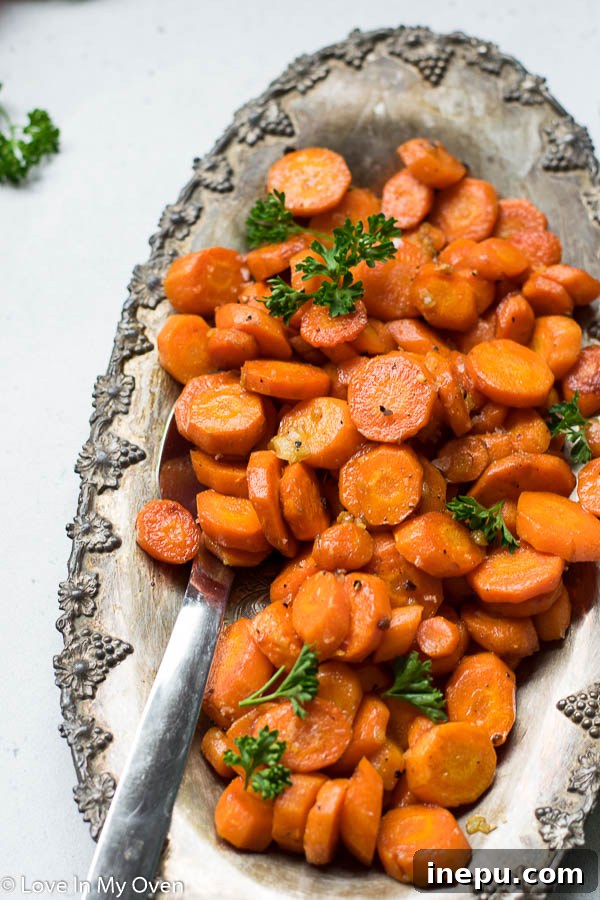 Close-up of golden-brown garlic butter roasted carrots