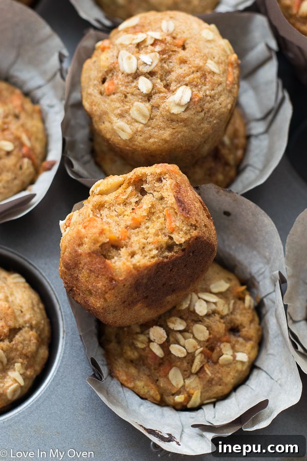 Sunshine Carrot Banana Muffins 8 Sliced healthy banana carrot muffin revealing its moist, carrot and banana-studded interior.
