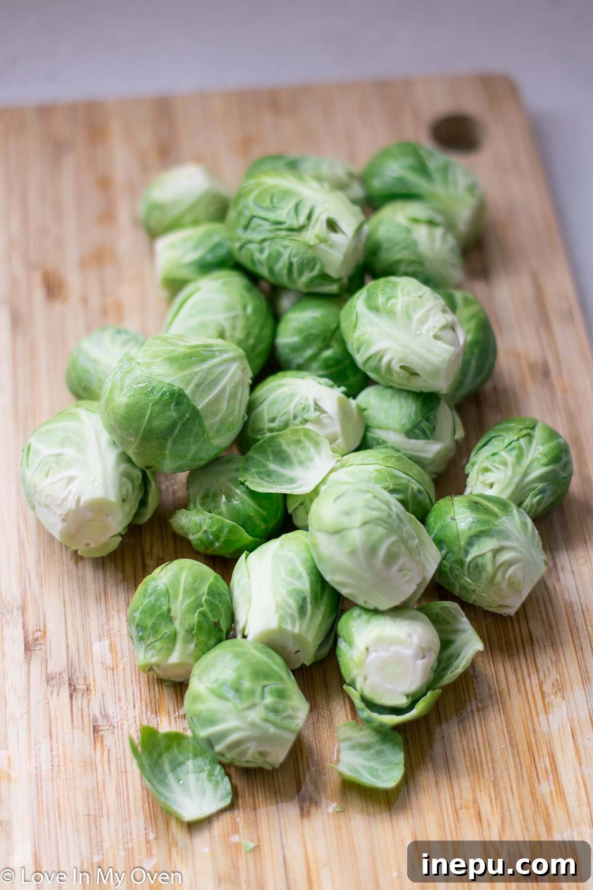 Crispy Shredded Brussels Sprouts with Garlic 4 Preparing to shred Brussels sprouts for sautéing